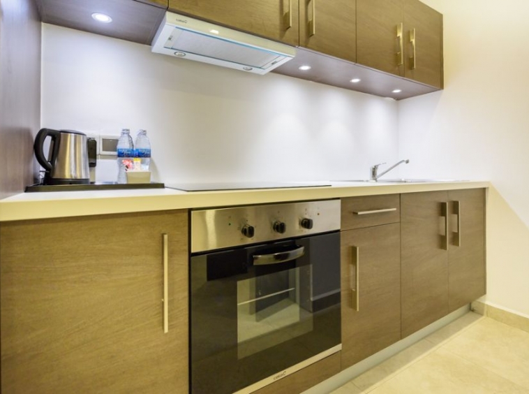 the kitchen of the 1-bedroom luxury serviced apartment for rent in BKK1 in Phnom Penh