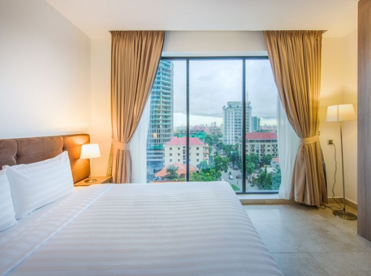 the bedroom of the 1-bedroom luxury serviced apartment for rent in BKK1 in Phnom Penh