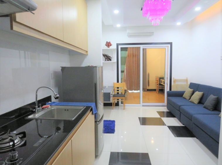 the living room and the kitchen of the well designed serviced condo for rent in TTP in Phnom Penh