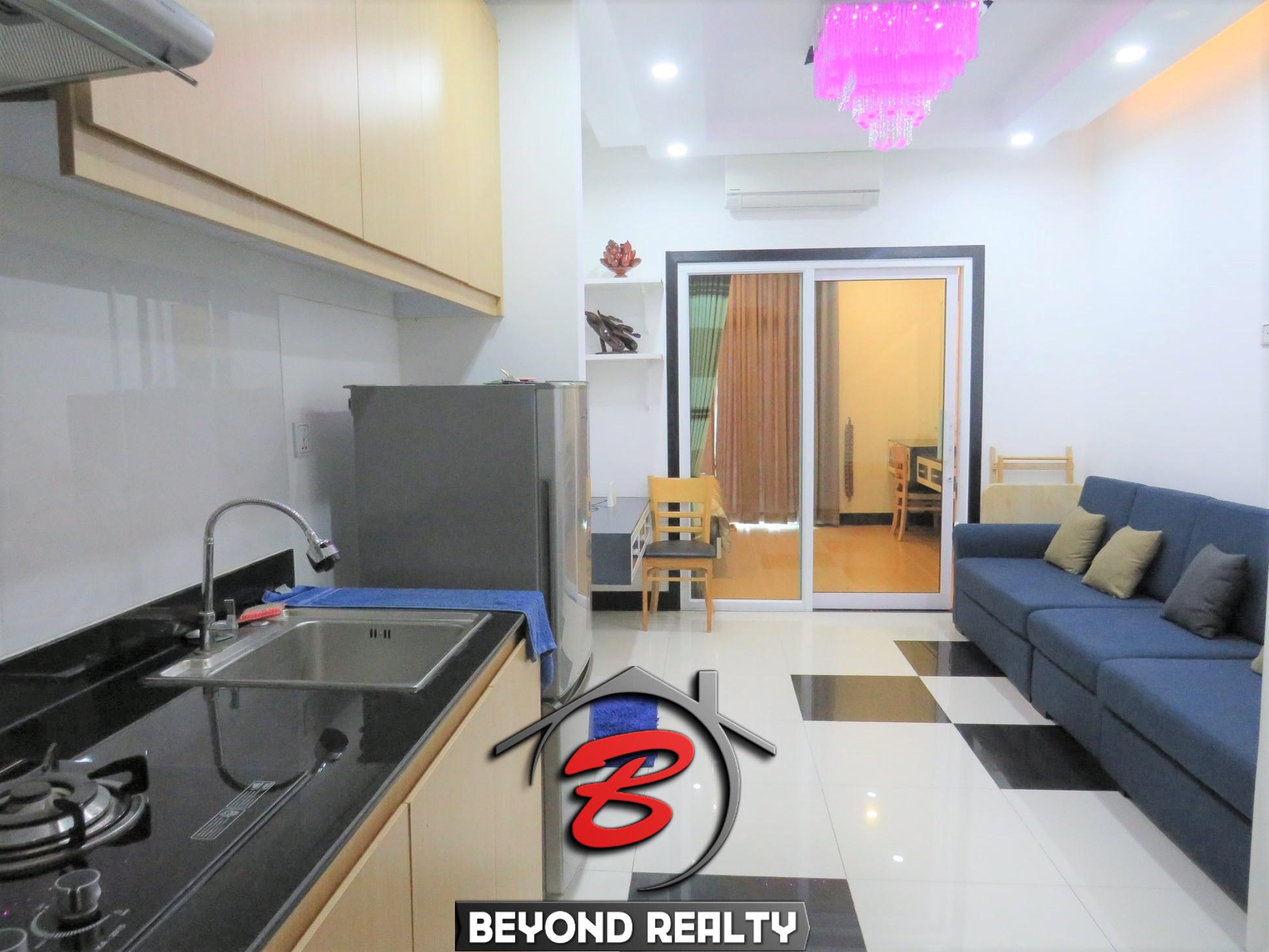 the living room and the kitchen of the well designed serviced condo for rent in TTP in Phnom Penh