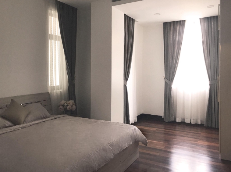 the bedroom of the 1br luxury serviced condo for rent in Sangkat Srah Chak in Daun Penh in Phnom Penh Cambodia