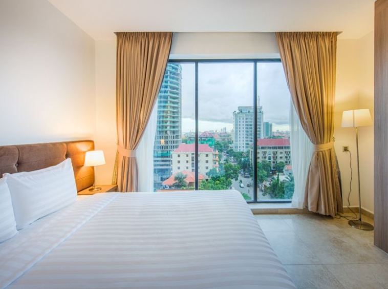 a bedroom of the 2-bedroom spacious luxury serviced apartment for rent in BKK1 in Phnom Penh Cambodia