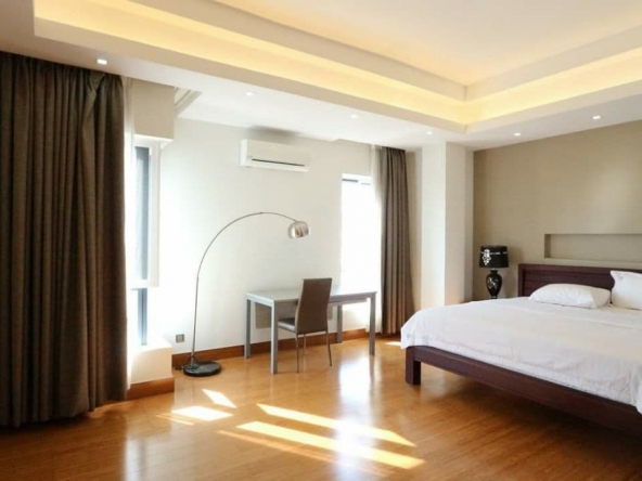 a bedroom of the 3-bedroom luxury serviced apartment for rent in BKK1 in Phnom Penh Cambodia