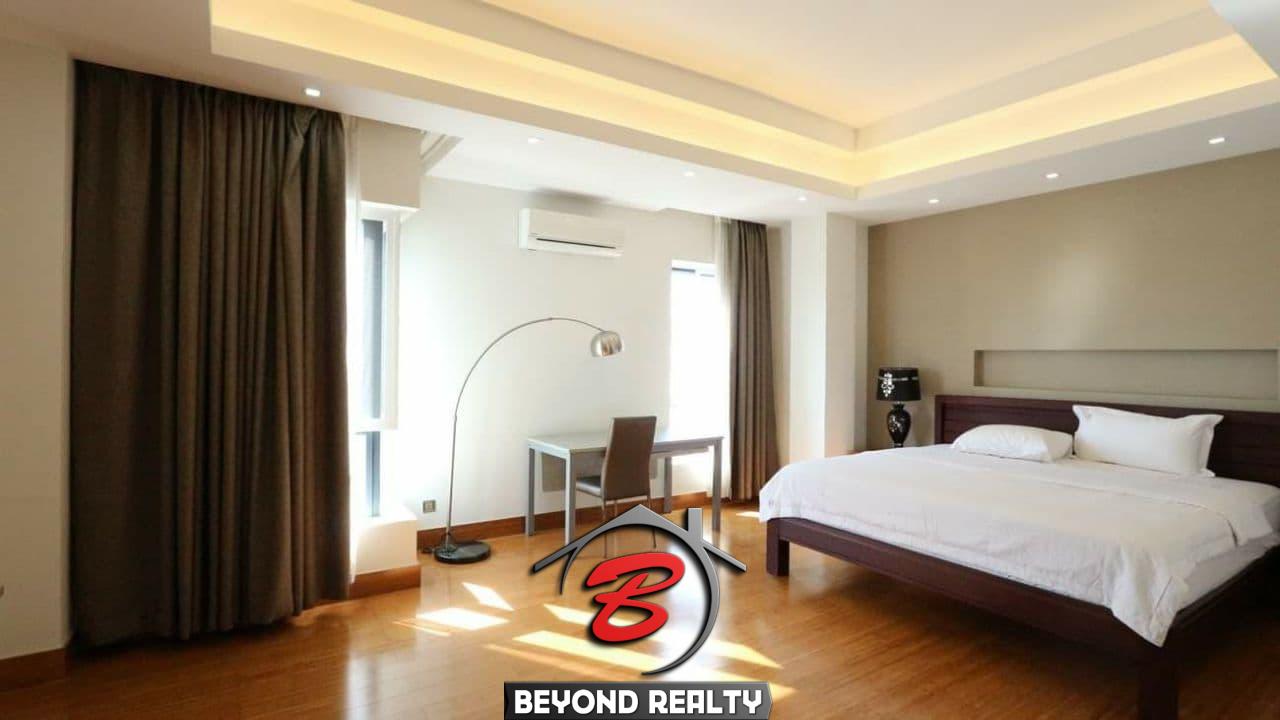 a bedroom of the 3-bedroom luxury serviced apartment for rent in BKK1 in Phnom Penh Cambodia
