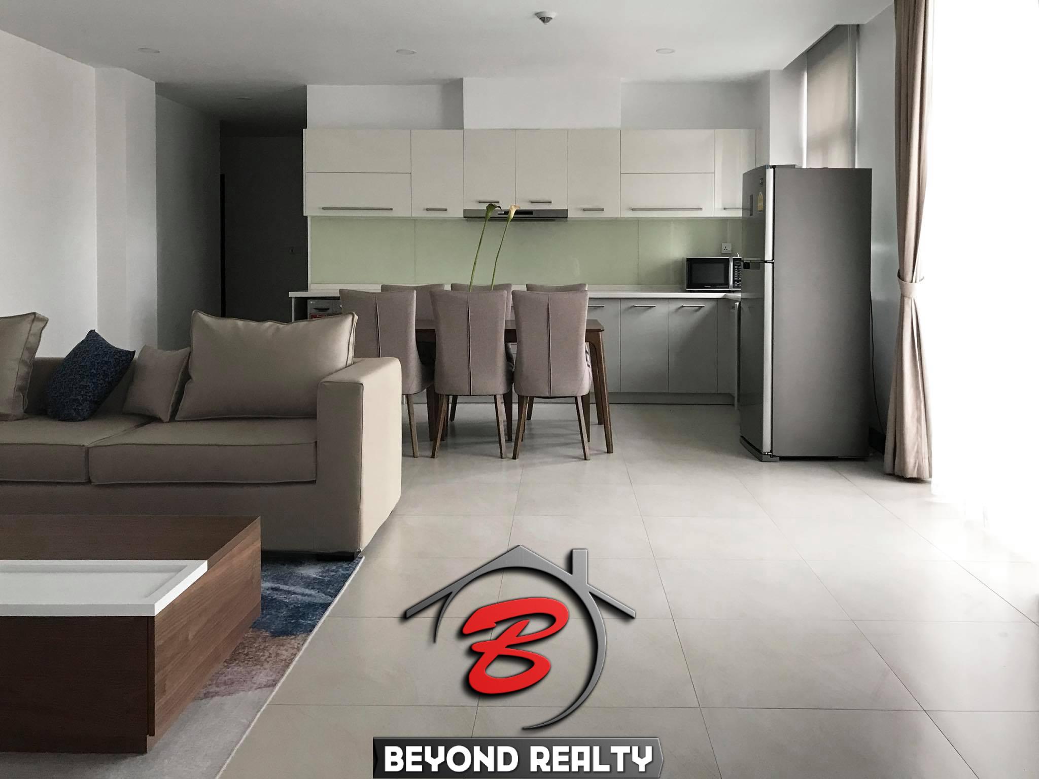 the living room and the kitchen of the 3br luxury serviced condo for rent in Sangkat Srah Chak in Daun Penh in Phnom Penh Cambodia
