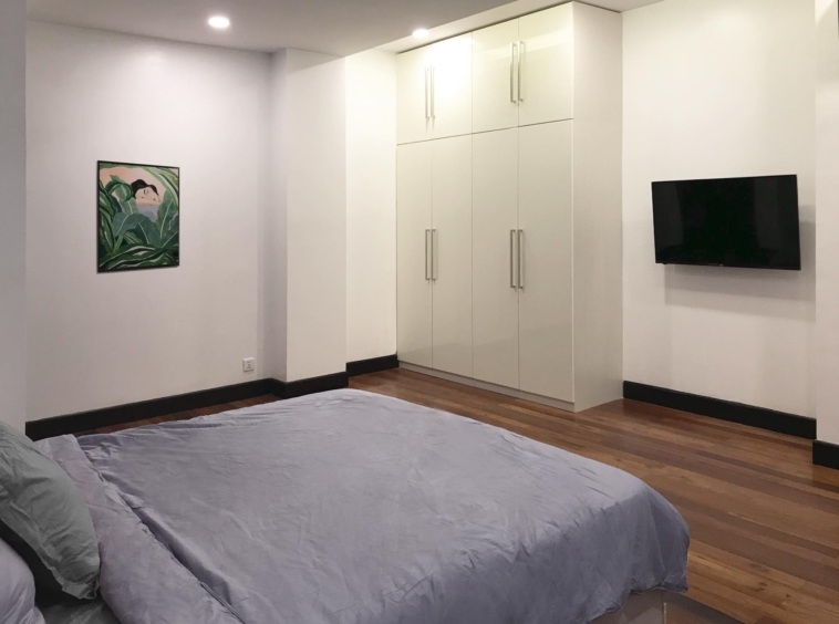 a bedroom of the 3br luxury serviced condo for rent in Sangkat Srah Chak in Daun Penh in Phnom Penh Cambodia