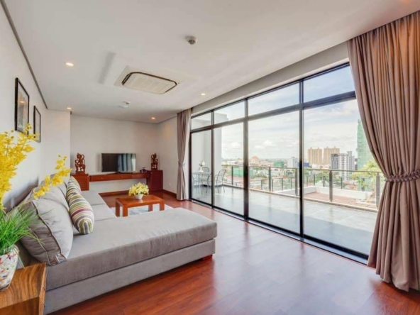 the living room and the terrace of the 4-bedroom duplex penthouse for rent in BKK1 in Phnom Penh Cambodia