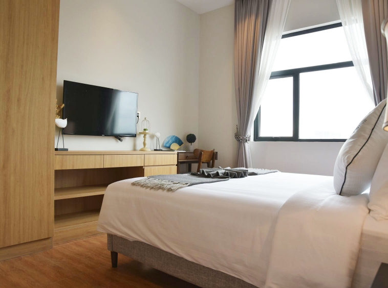 the bedroom of the luxury serviced studio apartment for rent in BKK1 in Phnom Penh Cambodia