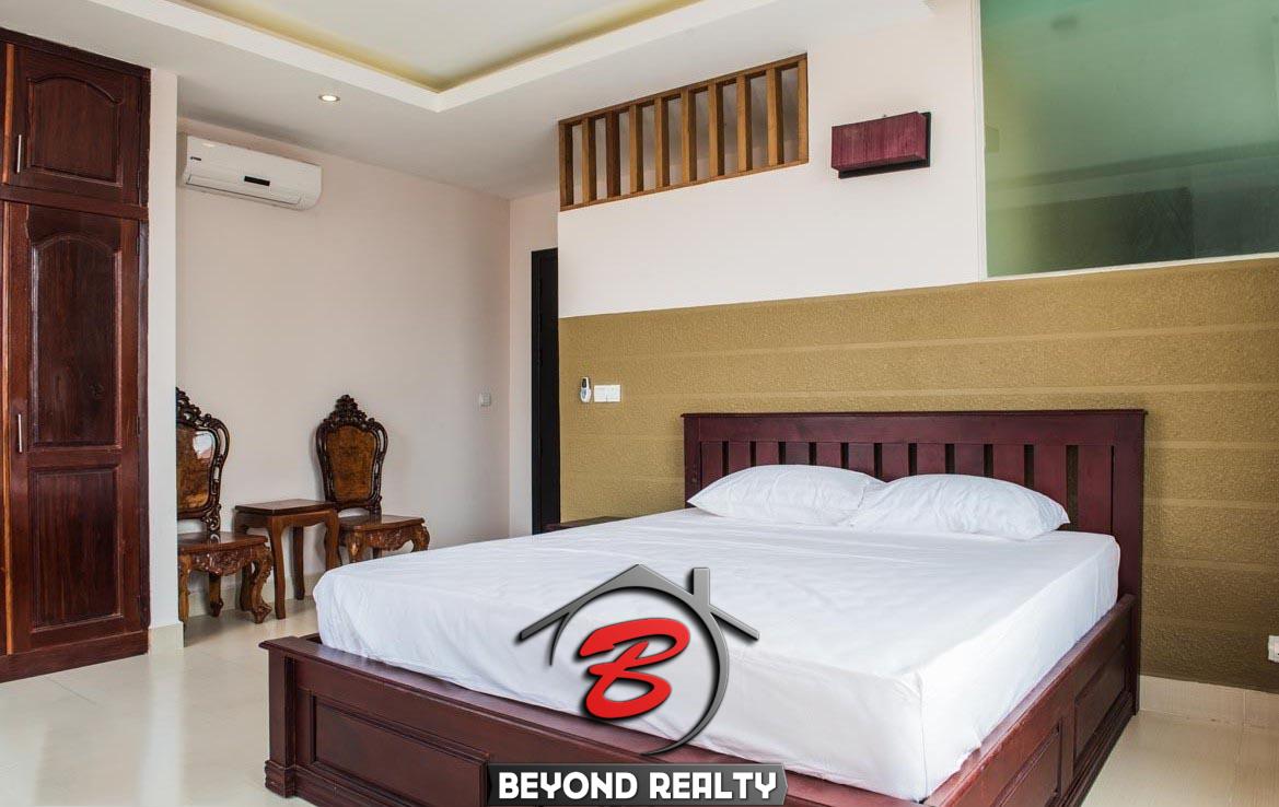 a bedroom of the 2-bedroom spacious luxury serviced apartment for rent in BKK1 in Phnom Penh Cambodia