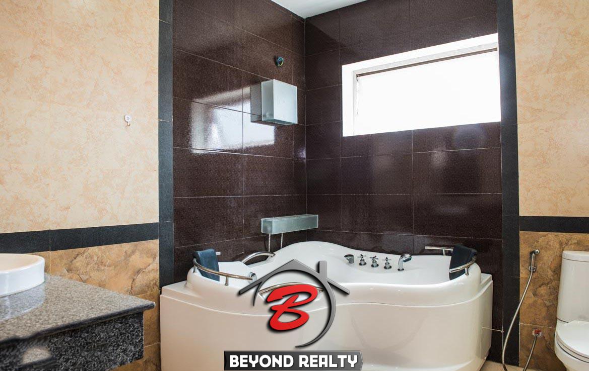 the jacuzzi in a bathroom of the 2-bedroom spacious luxury serviced apartment for rent in BKK1 in Phnom Penh Cambodia