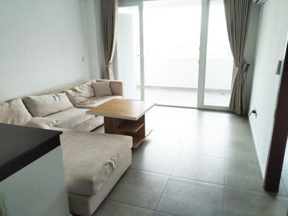 the living room of the 1-bedroom condo for rent in Sangkat 4 in Sihanoukville