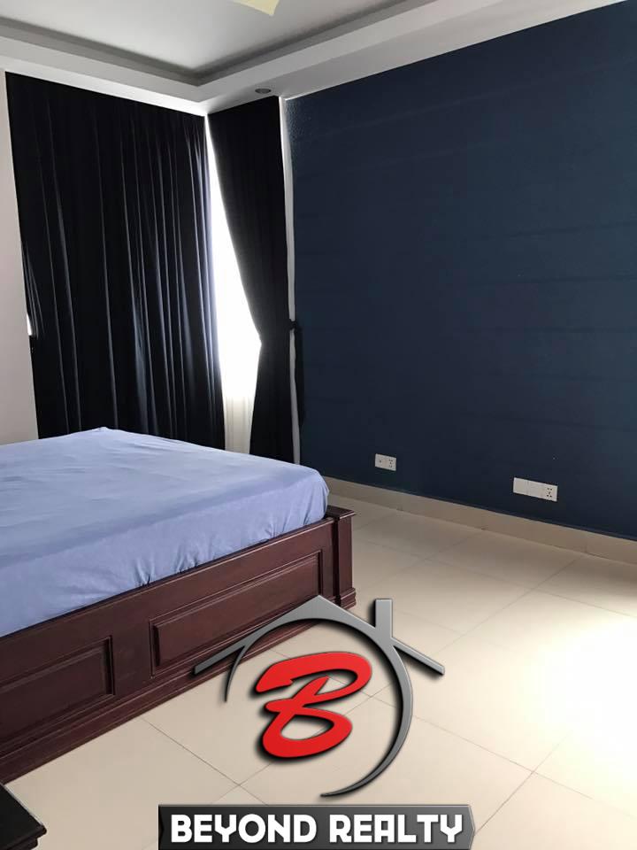 a bedroom of the 3-bedroom luxury spacious serviced apartment for rent in BKK1 in Phnom Penh Cambodia