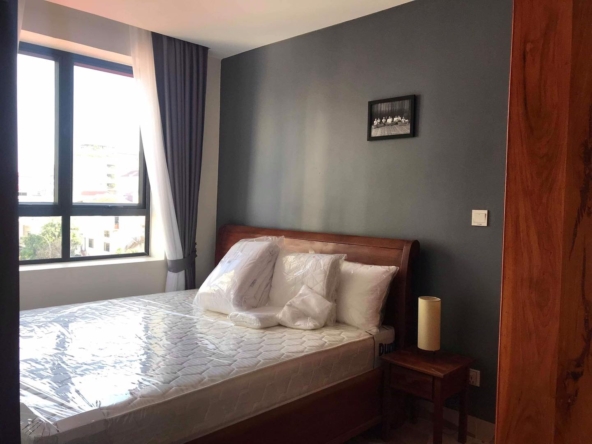 the bedroom of the 1-bedroom serviced apartment for rent in BKK3 in Phnom Penh Cambodia