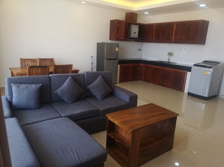 the living room and the kitchen of the 1br serviced apartment for rent in Toul Tom Poung Phnom Penh Cambodia