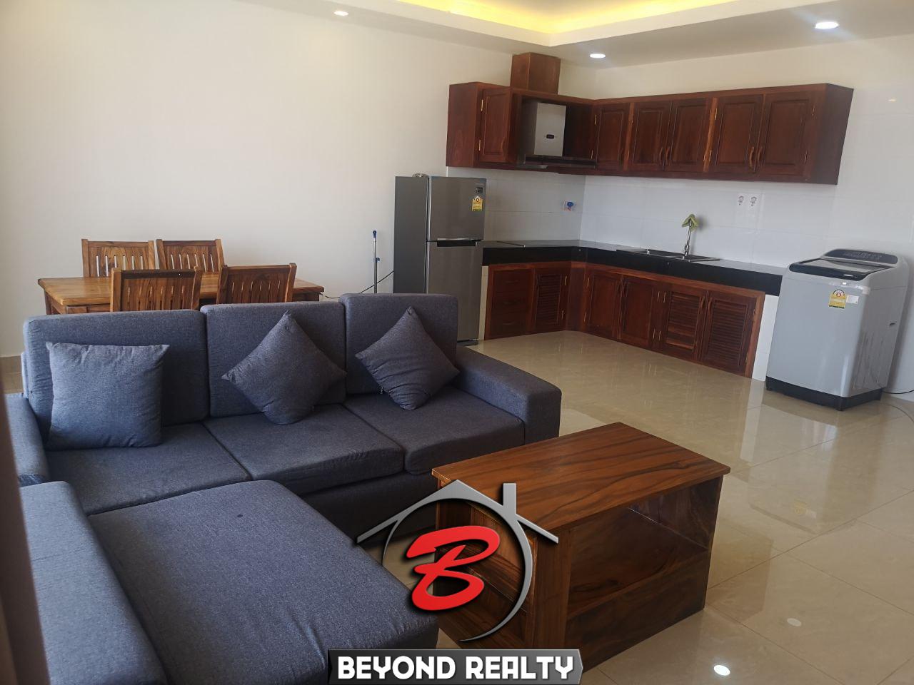 the living room and the kitchen of the 1br serviced apartment for rent in Toul Tom Poung Phnom Penh Cambodia