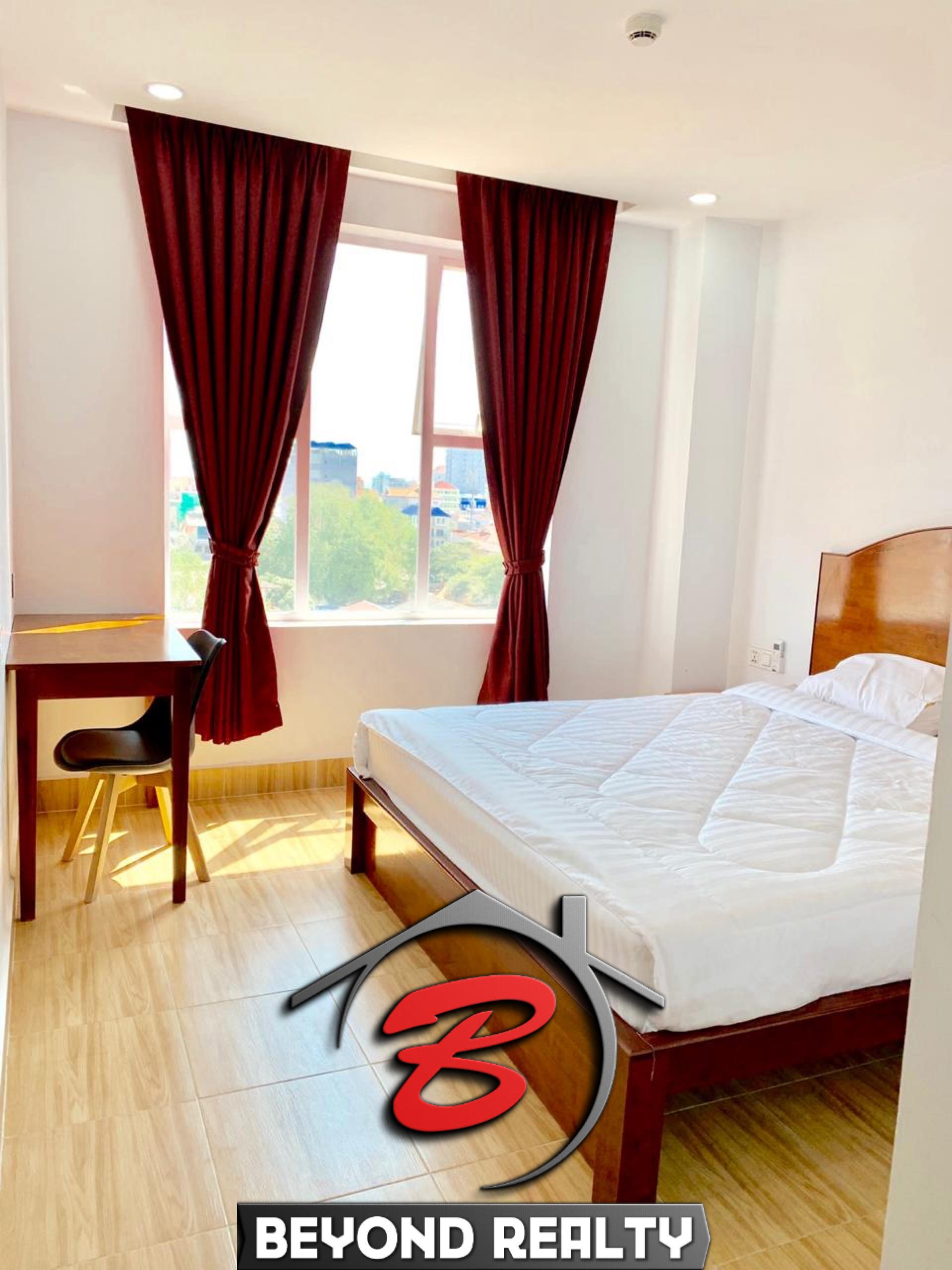 the bedroom of the 1br serviced apartment for rent in Toul Tom Poung near Mao Tse Boulevard in Phnom Penh Cambodia