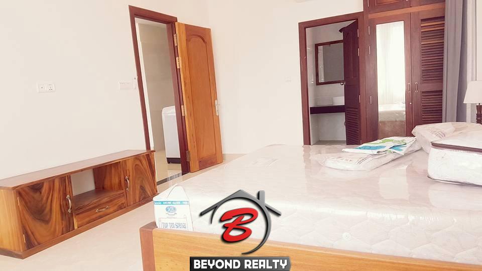 a bedroom of the 2-bedroom spacious serviced apartment rental in Toul Tom Poung