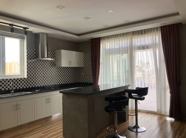 the kitchen of the 3-bedroom penthouse serviced apartment for rent in Tonle Bassac Phnom Penh Cambodia
