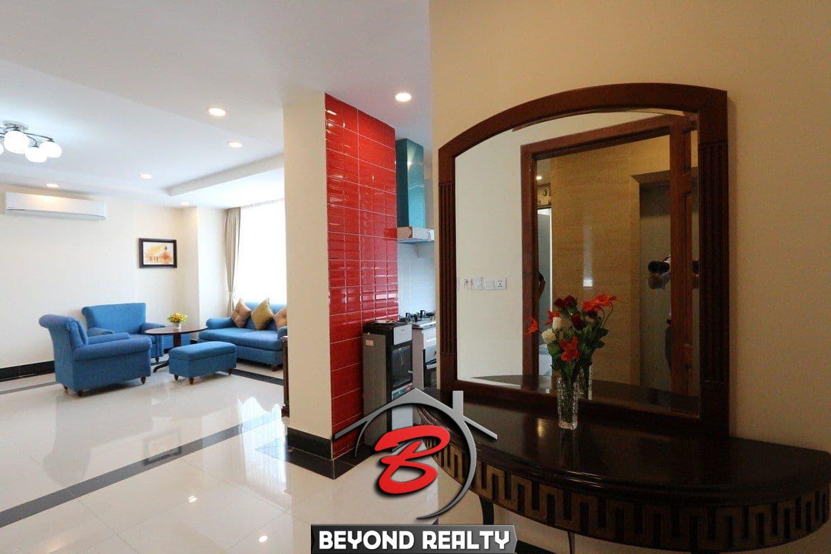 the kitchen and the living room of the 3-bedroom apartment for rent in BKK1 Phnom Penh Cambodia