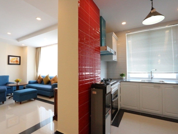 the kitchen and the living room of the 3-bedroom apartment for rent in BKK1 Phnom Penh Cambodia
